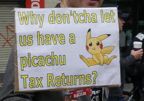 Image of Pikachu on sign: “Why don'tcha let us have a picachu Tax Returns?”