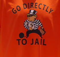 Monopoly board game parody: “Go directly to jail” (Trump holding moneybag)