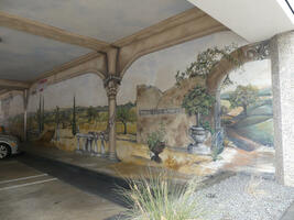 Mural of greek/roman ruins on a parking structure wall