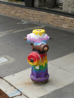 Hydrant painted in colors of trans pride and gay pride flags