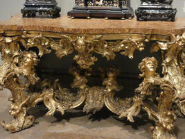 Table with gold scrollwork on legs with heads of women