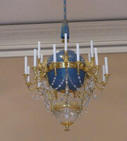 Chandelier with blue sphere in center, decorated with stars