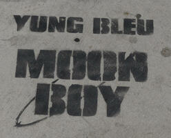 “YUNG BLEU MOON BOY” spray painted on sidewalk