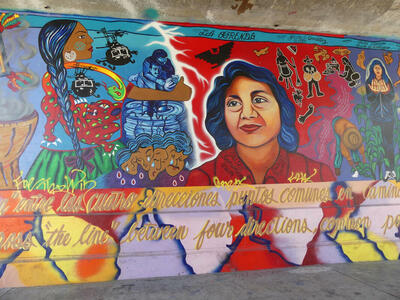 Mural depicting mexican peasant woman, and a latina woman in center