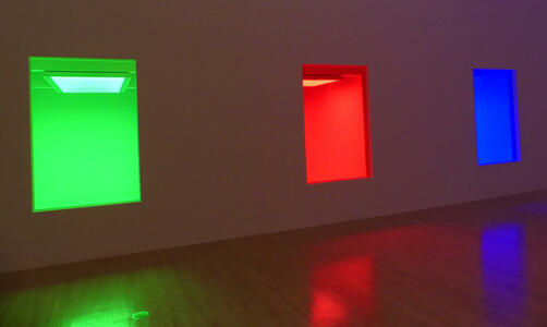 Rooms lit by green, red, and blue fluorescent bulbs