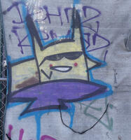 Pikachu with sunglasses painted on a construction site canvas