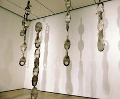 Large chains wrapped in plastic, hanging from ceiling