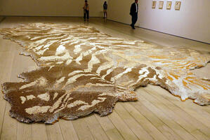 Large “carpet” in shape of a tiger skin, made of cigarettes