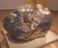 Large stainless steel sculpture in shape of a rock