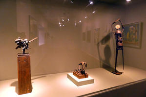 Abstract metal sculptures, one is clockwork in the shape of a man