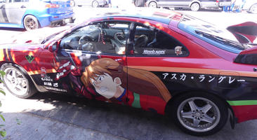 Car with painting of character from Evangelion anime on side