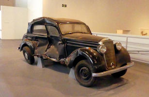 1940s vintage car with side smashed in