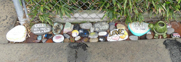 Painted stones with wods like LOVE, DO GOOD, SHINE.