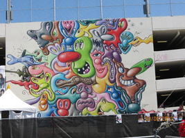 Whimsical cartoon-like painting on side of parking garage