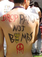 Man with bodypaint: Drop pants, not bombs