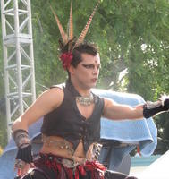 Male belly dancer with spiky hair