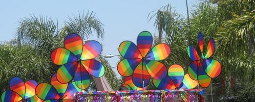 Rainbow-colored pinwheels on a float