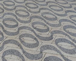 sidewalk tiles with wavy pattern and circles between the waves