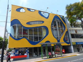 Long view of building with abstract blue/yellow design