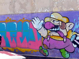 Graffitti showing an evil version of Mario from Mario brothers.