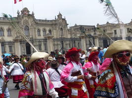 Men in Peruvian dress and masks