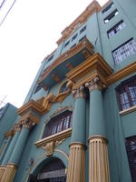 blue building with gold columns