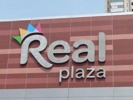 R in “Real Plaza” has a crown on it.