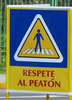 Sign showing pedestrian in crosswalk