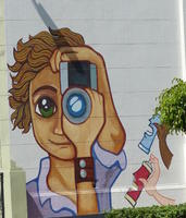cartoonish image of boy holding video camera