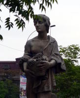 Statue of woman carrying grapes