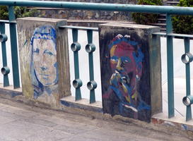 Faces painted on bridge structure