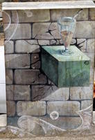 “Trompe l'oeil” painting of shelf extending out of brick wall