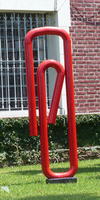 Sculpture resembling a large red paper clip