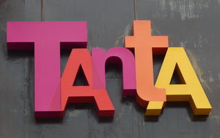 purple, red, orange, yellow logo for restaurat TAntA