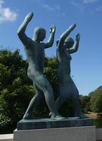 Man and woman dancing, hands in air.