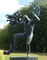 Man with children playing on arms and leg