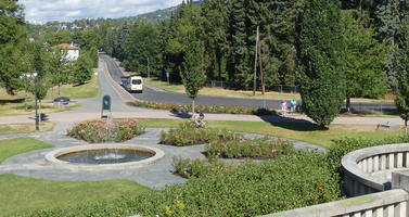 Fountain in foreground, road in background