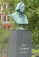 Bust of frowning man with long hair