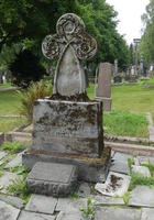 Headstone with trefoil shape at top