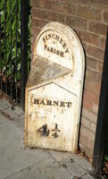 Street marker reading “Finchley Parish, Barnet 4 1/4” (four and one fourth)