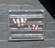 Wall painting: hands grabbing ventilator grill panels