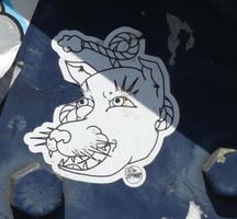 Sticker showing cat-like creature’s face