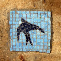 Blue mosaic tile depicting bird