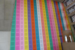 wall of colored paper covered in text