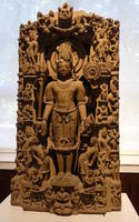 Carving of standing Indian man