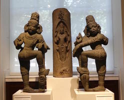 Standing Indian figures, knee bent, hand on knee.