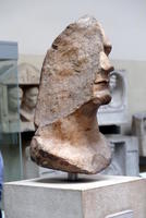 Bust of man’s head, split to reveal interior of stone.