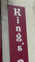Sign with vertical lettering and reversed apostrophe