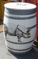 Barrel with painting of pig wearing sunglasses
