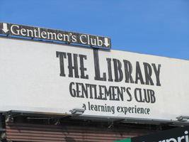 Billboard: “The Library / Gentlemen's Club / a learning experience”